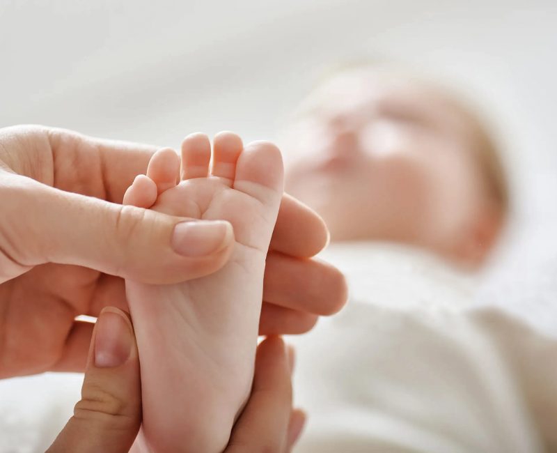 doctor examining a baby in a hospital